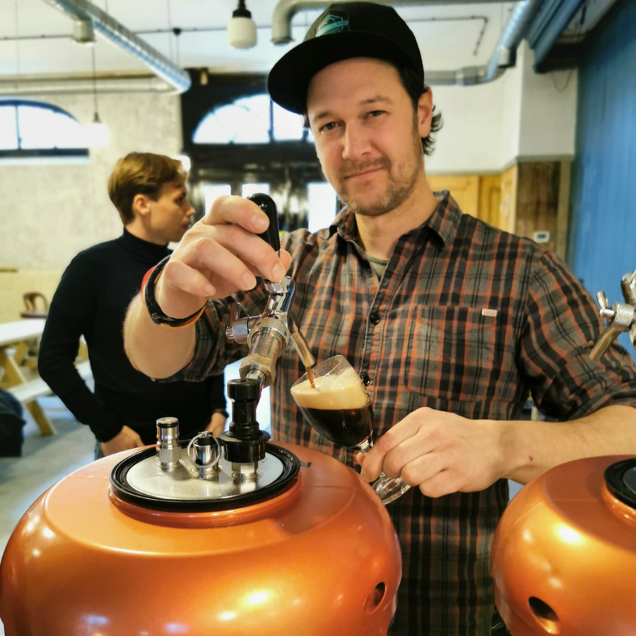 Pouring a stout straight from the MiniBrew Smart Keg