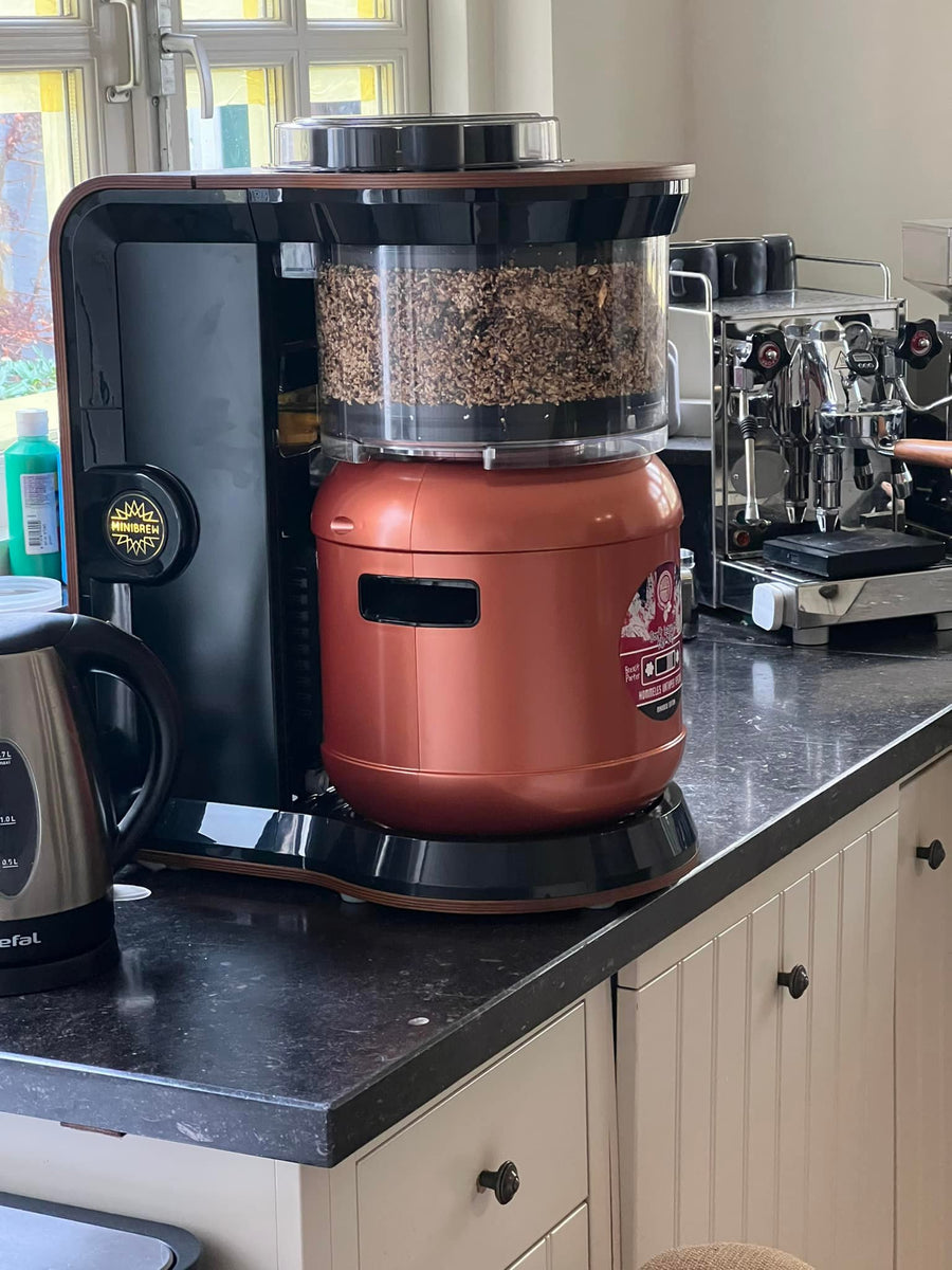 The MiniBrew CRAFT brewing on a kitchen counter